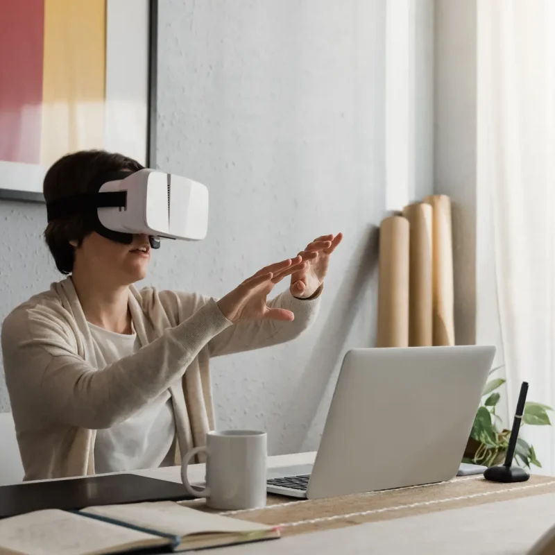 Young architect woman using vr headset for real estate virtual reality tour development